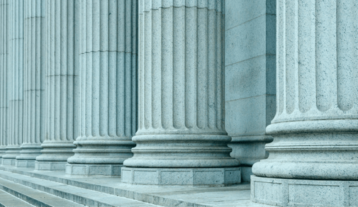 Large stone columns on a government building.