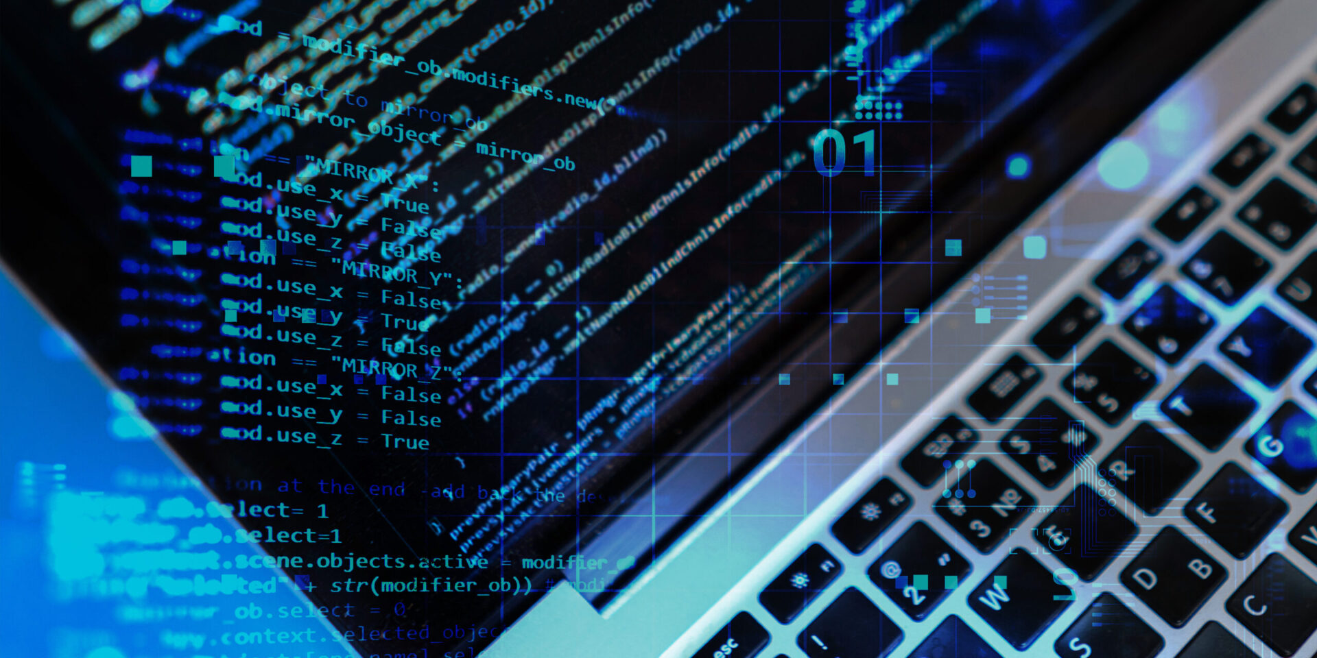 Image en gros plan du clavier et de l'écran d'un ordinateur personnel Mac avec superposition de code source.
