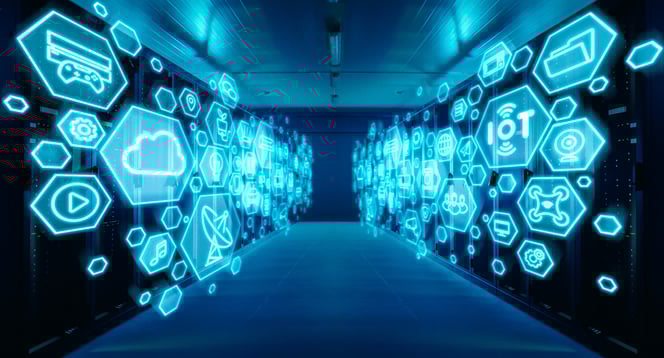 Wide-angle shot of a working data center with rows of rack servers with different computer illustrative icons and symbols in the foreground. Internet technology concept with blue lights.